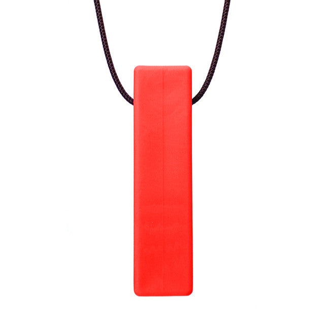 There is a smooth brick shaped pendant on a black cord. The pendant is red coloured and designed to be chewed on.