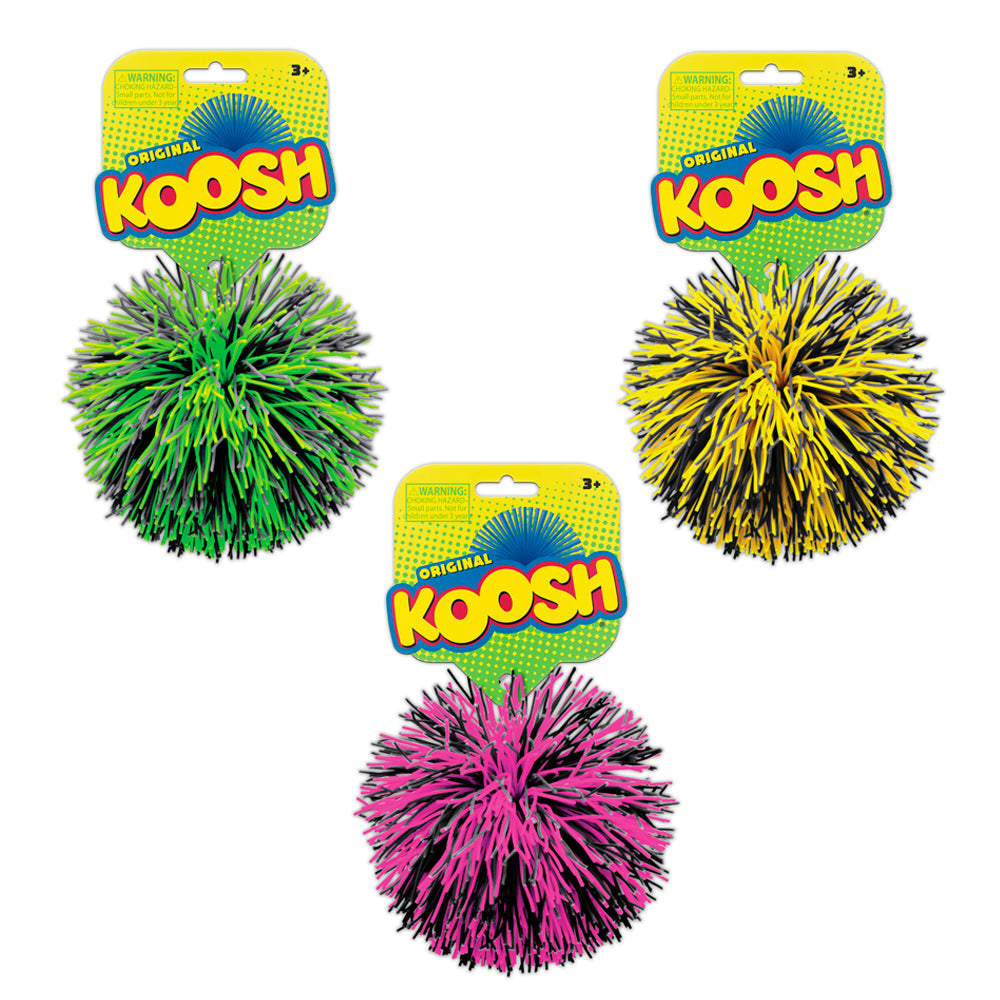 Three Koosh balls in green, yellow, and pink on their packaging with 'Original Koosh' branding.
