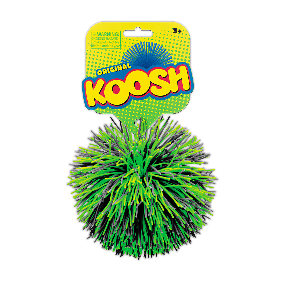 Green and black Koosh ball with packaging on a white background