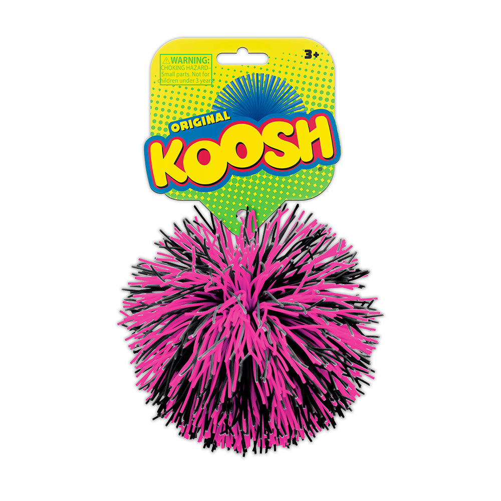 Pink and black Koosh ball with packaging on a white background