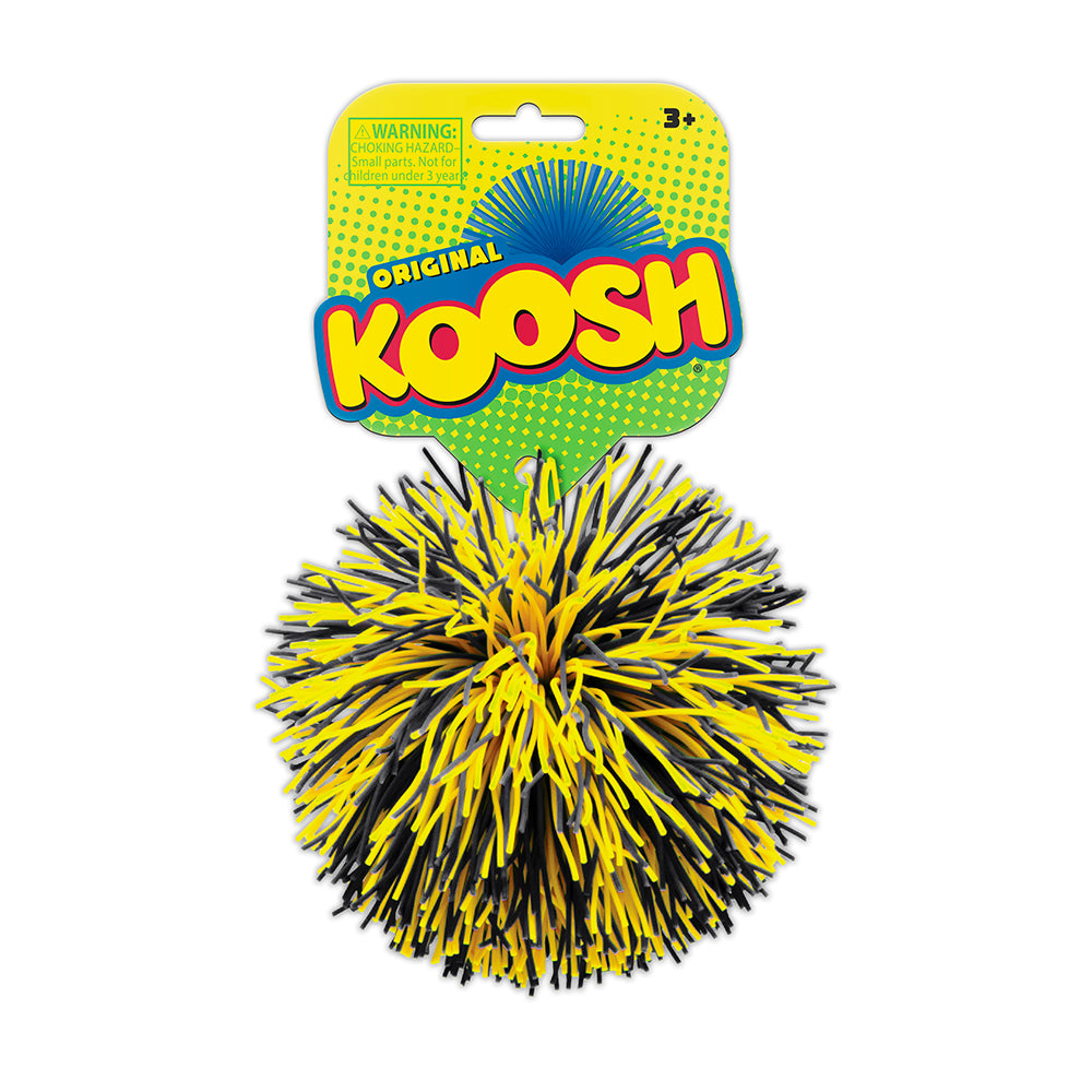 Yellow and black Koosh ball with packaging on a white background