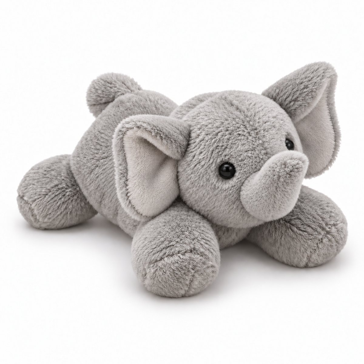 A light gray plush elephant toy lying down, featuring soft textured fabric, large floppy ears, small black bead eyes, and a trunk, photographed on a clean white background.