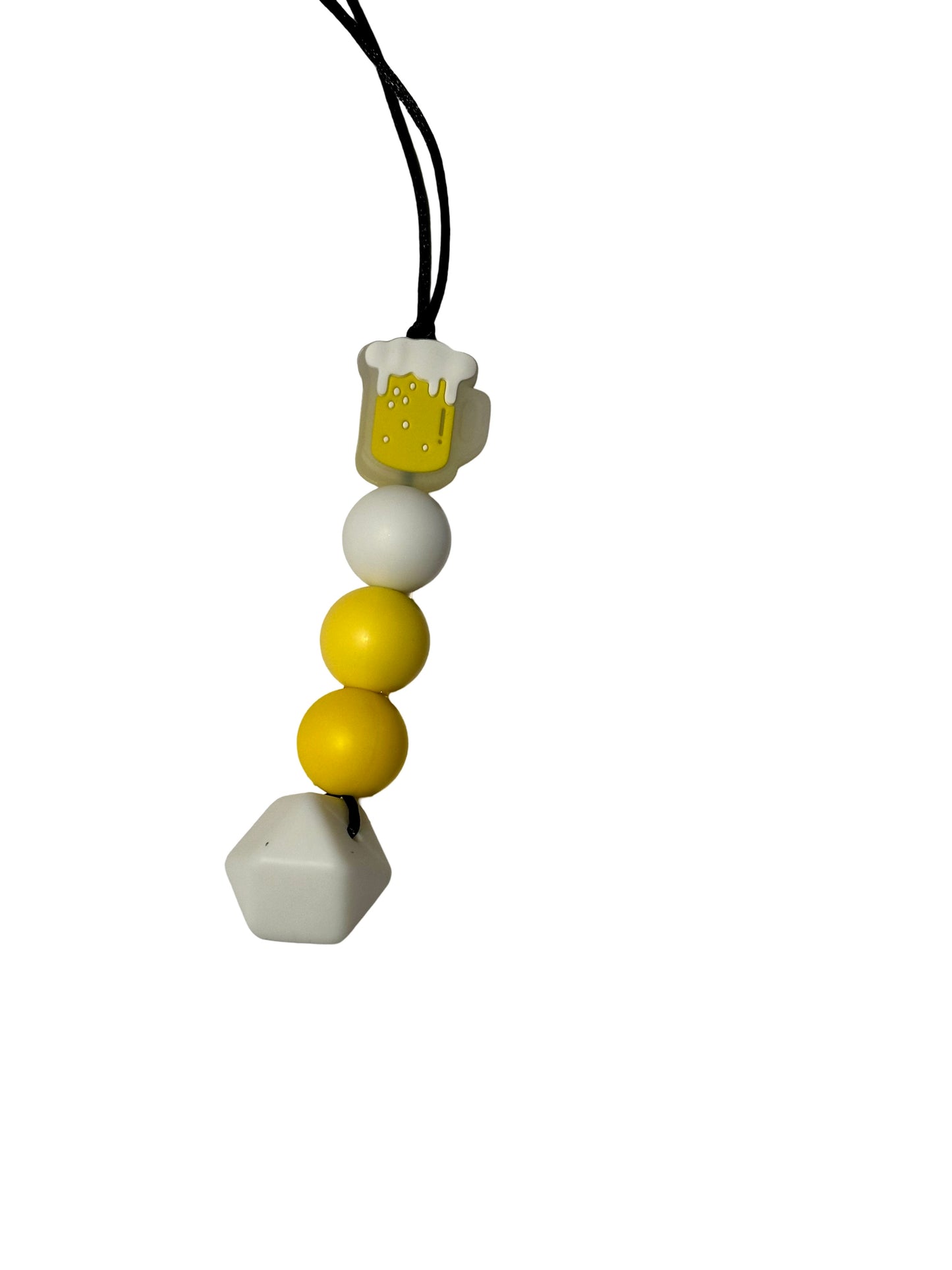 There is a beer mug chewable bead at the top with four beads following. They are a white round bead, two yellows in different shades and a white hexagon bead. 