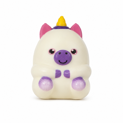 A cute, white squishy unicorn toy with pink ears, a purple snout, a yellow horn, and glittery purple hooves, centered on a white background.