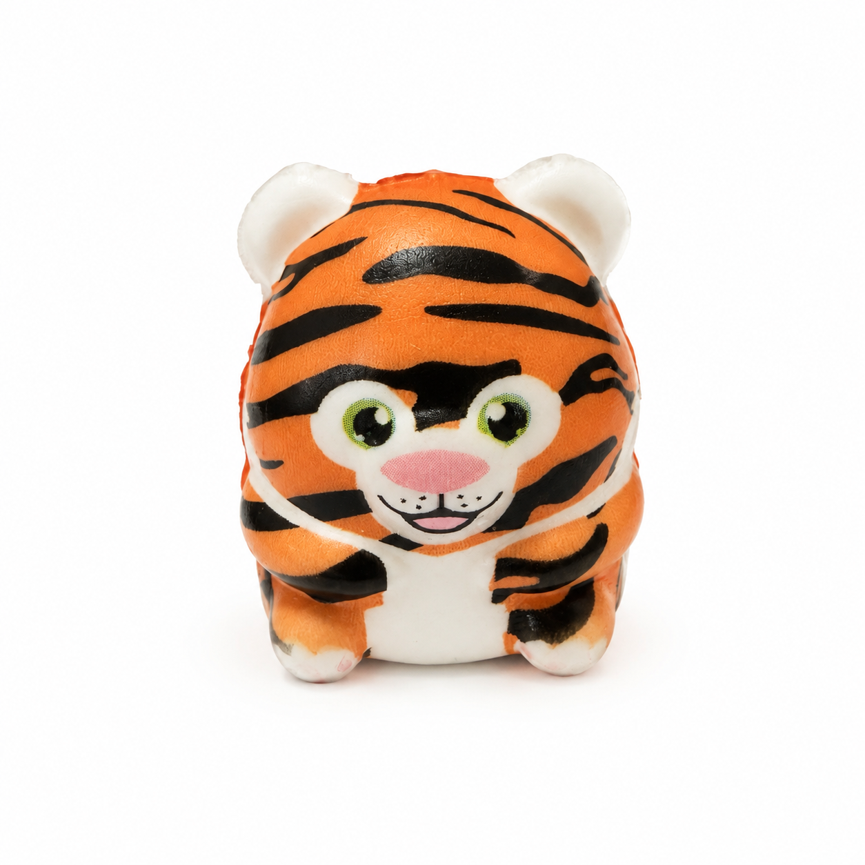 A small squish tiger toy with orange and black stripes, large green eyes, a pink nose, and white accents, photographed on a clean white background.