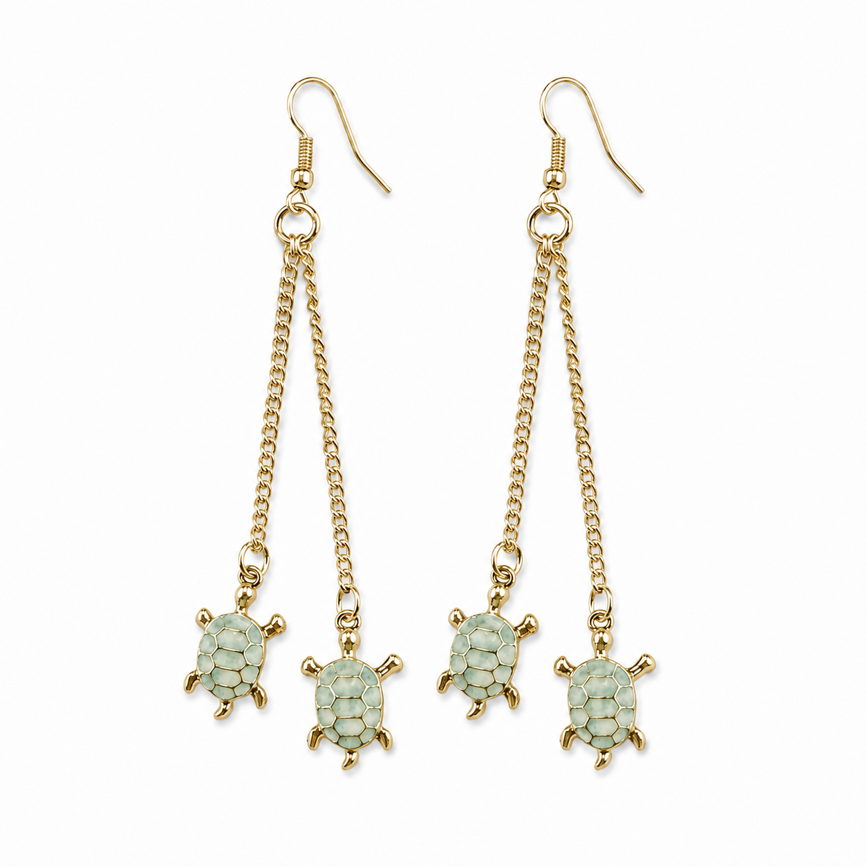 Pair of long gold-tone fish-hook earrings, each featuring two delicate chain drops finished with light green turtle charms, displayed against a white background.