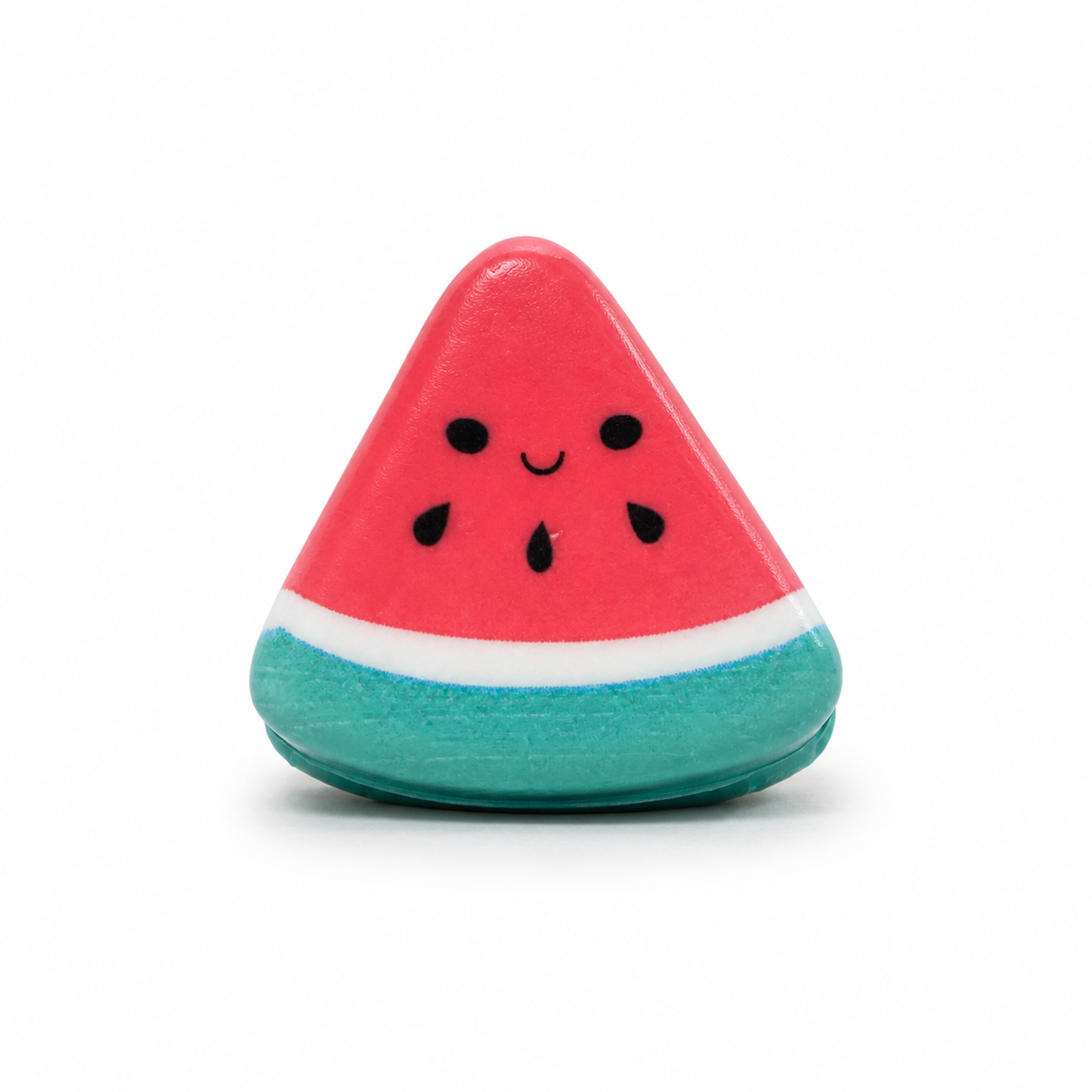 Small triangular watermelon squishy with pink fruit, black seed details, a smiling face, white inner rind, and turquoise-green outer rind, shown upright against a white background.